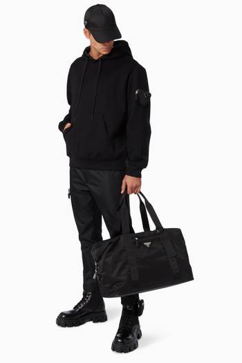 hover state of Triangle Logo Duffle Bag in Nylon & Saffiano Leather     