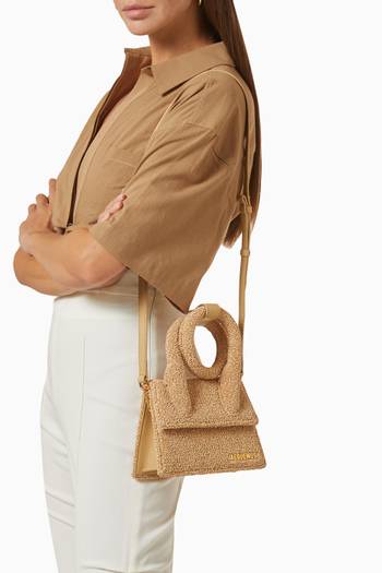 hover state of Le Chiquito Noeud Coiled Handbag in Curly Raphia