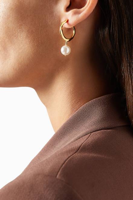 hover state of Feminine Waves Pearl Hoop Earrings in 18kt Gold-Plated Brass    